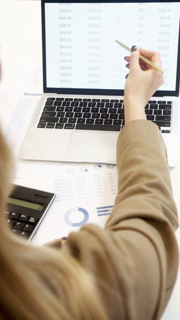 pexels-photo-6779339-6779339 Business professional analyzing financial data on a laptop for strategic decision making.